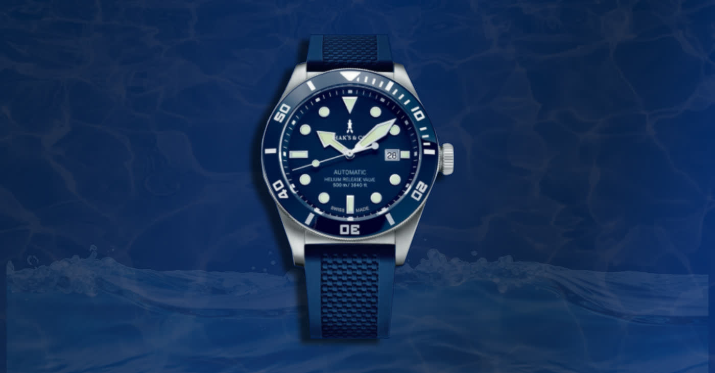 The Marine: a blue dive watch with a rotating bezel, against deep water